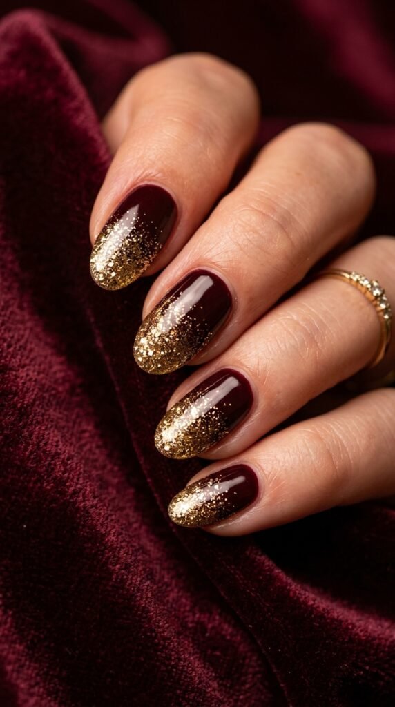 Maroon_nails_with_gold_glitter_202608291209